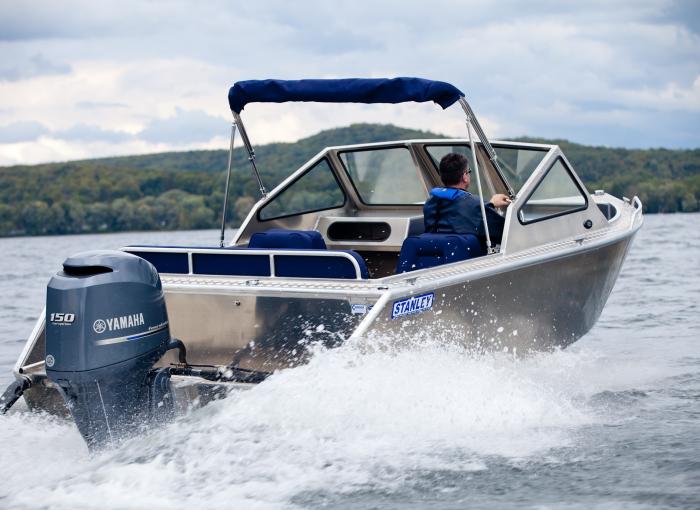 1 man driving a Stanley aluminum boat powered by a yamaha 150 HP outboard engine